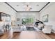Bright living room with hardwood floors, high ceilings, and access to the outdoor patio at 2518 Dick Wilson Dr, Sarasota, FL 34240