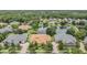 Aerial view of homes overlooking pond in established community at 27427 Mistflower Dr, Wesley Chapel, FL 33544