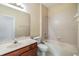 Full bathroom featuring tile flooring, tub/shower combo and single sink vanity at 27427 Mistflower Dr, Wesley Chapel, FL 33544