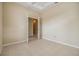 Bedroom with tiled floor leading to french doors at 27427 Mistflower Dr, Wesley Chapel, FL 33544
