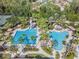 Aerial view of community pool with water slide, lap lanes, and splash area at 27427 Mistflower Dr, Wesley Chapel, FL 33544