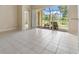 Open living space leads to screened lanai with tranquil pond view at 27427 Mistflower Dr, Wesley Chapel, FL 33544