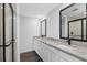 Modern bathroom featuring double sinks, granite countertops, and a walk-in shower at 29613 Fedora Cir, Brooksville, FL 34602