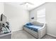 Bright bedroom with plush carpeting, complemented by a comfortable bed and a 'Game On' wall sign at 30762 Parrot Reef Ct, Wesley Chapel, FL 33545