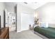 Cozy bedroom featuring plush carpeting, neutral walls, and a closet, creating a serene retreat at 30762 Parrot Reef Ct, Wesley Chapel, FL 33545