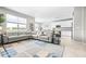 Spacious living room showcases an oversized sectional sofa, large windows, and an open floor plan at 30762 Parrot Reef Ct, Wesley Chapel, FL 33545