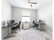 Well-lit office space featuring two desks, monitors, and a comfortable setup for a productive work environment at 30762 Parrot Reef Ct, Wesley Chapel, FL 33545