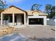 Exterior view of a home under construction showing the frame and foundation work in progress, garage entrance, and basic structure at 3110 19Th N St, St Petersburg, FL 33713