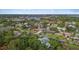 A home nestled in a lush, green neighborhood with scenic water views visible in the distance at 3235 Walnut Ne St, St Petersburg, FL 33704