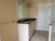 Bathroom featuring a granite countertop, dual sinks and large mirror at 3235 Walnut Ne St, St Petersburg, FL 33704