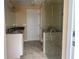 Bathroom with granite countertop, dual sinks and glass shower at 3235 Walnut Ne St, St Petersburg, FL 33704