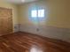 Bedroom featuring hardwood floors and natural light from a window at 3235 Walnut Ne St, St Petersburg, FL 33704