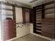 Walk-in closet with custom shelving and storage at 3235 Walnut Ne St, St Petersburg, FL 33704