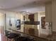 Bright kitchen with custom cabinets, a granite island, and stainless steel appliances at 3235 Walnut Ne St, St Petersburg, FL 33704