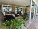 Covered patio with comfortable seating and lush plants at 3235 Walnut Ne St, St Petersburg, FL 33704