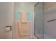 Bathroom featuring tiled shower with glass door and coordinated towels at 3301 Alt 19 # 819, Palm Harbor, FL 34683
