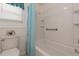 Bright bathroom features a tiled shower/tub combo with a grab bar and modern fixtures at 3301 Alt 19 # 819, Palm Harbor, FL 34683