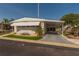Charming single-story home featuring a carport, awnings, and well-maintained landscaping at 3301 Alt 19 # 819, Palm Harbor, FL 34683