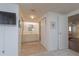 Hallway with a view of the sink, storage cabinet and a mounted TV at 3301 Alt 19 # 819, Palm Harbor, FL 34683