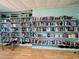 Community library with floor-to-ceiling bookshelves filled with a vast collection of books for residents to enjoy at 3301 Alt 19 # 819, Palm Harbor, FL 34683