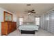 Main bedroom features large bed, dresser, and soft lighting at 3301 Alt 19 # 819, Palm Harbor, FL 34683