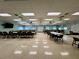 Expansive meeting room with tables, chairs, ceiling fans, recessed lighting, and a television at 3301 Alt 19 # 819, Palm Harbor, FL 34683