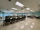 Large meeting room featuring tables, chairs, ceiling fans, recessed lighting, and large windows at 3301 Alt 19 # 819, Palm Harbor, FL 34683
