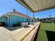 Outdoor seating area with tables and chairs, plus bocce ball court view at 3301 Alt 19 # 819, Palm Harbor, FL 34683