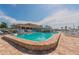 A large swimming pool in the community on a sunny day with the community center in the background at 3301 Alt 19 # 819, Palm Harbor, FL 34683