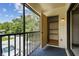 Screened in balcony with an outdoor storage closet and car view at 3389 Crystal E Ct # J, Palm Harbor, FL 34685