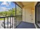 Screened in balcony with car view, sliding doors and outdoor carpet at 3389 Crystal E Ct # J, Palm Harbor, FL 34685