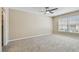 Bright bedroom with a ceiling fan, neutral walls, and carpeting provides a comfortable and inviting retreat at 3389 Crystal E Ct # J, Palm Harbor, FL 34685
