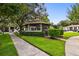 Community gazebo featuring manicured hedges and a sidewalk at 3389 Crystal E Ct # J, Palm Harbor, FL 34685