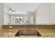 Stylish kitchen sink with granite countertops and modern faucet fixtures offers a sleek and functional space at 3389 Crystal E Ct # J, Palm Harbor, FL 34685