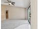 Bright living room with carpet and tile, sliding glass door with view, and white front door at 3389 Crystal E Ct # J, Palm Harbor, FL 34685