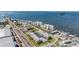 Stunning aerial of the community, showcasing its prime waterfront location and surrounding amenities at 340 Causeway Blvd # 105, Dunedin, FL 34698