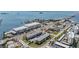 Aerial shot showcases the community, surrounding businesses, and convenient access to local waterways at 340 Causeway Blvd # 105, Dunedin, FL 34698