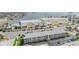 An aerial view of a condo complex across the street from a large commercial building near the water at 340 Causeway Blvd # 105, Dunedin, FL 34698