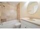 Updated bathroom with tile surround, tub and shower combo at 340 Causeway Blvd # 105, Dunedin, FL 34698