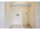 A clean and functional laundry room includes tile floors and washer-dryer hookups at 340 Causeway Blvd # 105, Dunedin, FL 34698