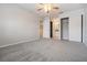 Main bedroom suite with carpeting, ensuite bathroom, and closet at 340 Causeway Blvd # 105, Dunedin, FL 34698