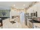 Well-lit kitchen with modern appliances, ample counter space, and stylish white cabinetry at 34447 Windknob Ct, Wesley Chapel, FL 33545