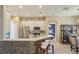 Stylish kitchen with stainless steel appliances, tile backsplash, and barstool seating at 34447 Windknob Ct, Wesley Chapel, FL 33545
