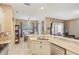 Bright kitchen featuring a breakfast bar, modern appliances, and easy access to the dining area at 34447 Windknob Ct, Wesley Chapel, FL 33545