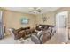 Comfortable living room with tile floors, neutral colors, and ample seating space at 34447 Windknob Ct, Wesley Chapel, FL 33545