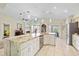 Open concept kitchen features a large island, granite countertops and stainless steel appliances at 4047 Eagle Cove West Dr, Palm Harbor, FL 34685