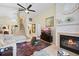 Comfortable living room with a stone fireplace and a soaring ceiling at 4047 Eagle Cove West Dr, Palm Harbor, FL 34685