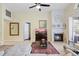 Spacious living room with a fireplace and a large window, offering plenty of natural light at 4047 Eagle Cove West Dr, Palm Harbor, FL 34685