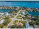 Overhead view of waterfront houses with boat docks, beautiful landscaping, and access to the tranquil open water at 431 Windward Psge, Clearwater Beach, FL 33767