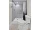 Bathroom featuring a sleek shower stall with a stylish shower curtain and modern tiling at 431 Windward Psge, Clearwater Beach, FL 33767